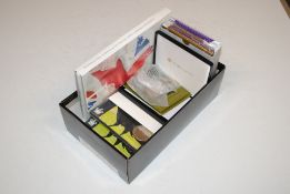 A box containing 24 £5 coins to include The Tower Of London coin collection, the Queens Platinum