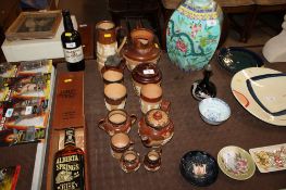 A collection of Royal Doulton Harvestware, jugs, beakers, tea pots, some with Egyptian Revival