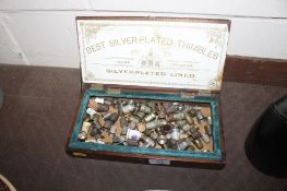 A Best silver plated thimbles wooden box and contents of various china and silver plated thimbles
