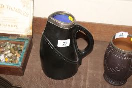 A Royal Doulton Lambeth stitched leather beer pitcher No.8600 with silver collar, approx. 21cm high