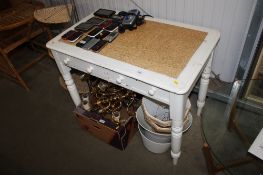 A painted pine two drawer side table