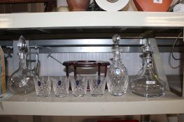 A Royal Doulton cut glass decanter and stopper together with two others; four Royal Doulton cut