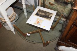A G-Plan style circular glass topped coffee table