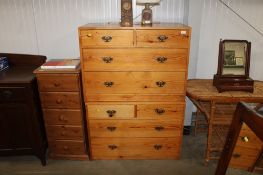 A pair of pine chests fitted two short over two long drawers