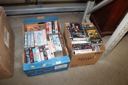 Two boxes of various videos