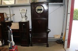 An oak hall stand with lift up storage and Art Nouveau style inlay