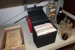 Two cases containing various 45rpm records