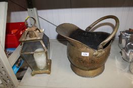 A brass coal scuttle together with a brass and glass lantern