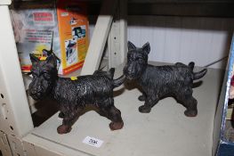 A pair of cast iron doorstops in the form of dogs