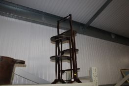 A folding mahogany cake stand