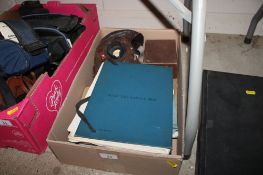An RAF WWII era Navigators log book full of log sheets, various booklets, flying helmet, night