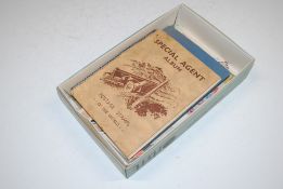 A box containing two stamp albums and various loose stamps