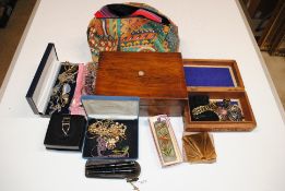 A box containing a large quantity of various costume jewellery to include bead necklaces, two wooden