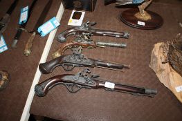 Four various replica flintlock pistols