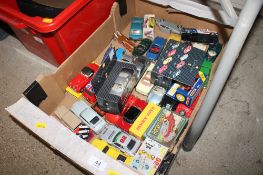 A box containing various die-cast vehicles to include Dinky, Matchbox, Corgi etc.
