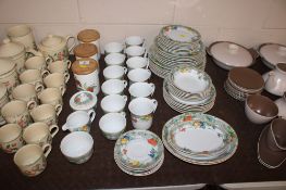 A Wedgwood 'Eden' pattern tea and dinner service and three Royal Worcester 'Evesham' storage jars