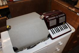 A World Master piano accordion with fitted case