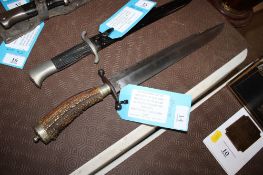 A large bowie knife, 18