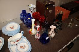 A quantity of art and coloured glassware to include blue glass globes, spill vases etc.