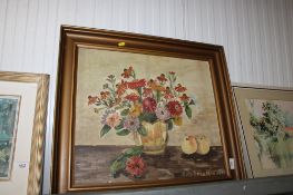 An oil on canvas still life study depicting flowers in a vase, indistinctly signed