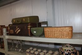 A wooden bound travel trunk together with a wooden trug, a wicker basket and one other case