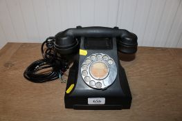 A vintage rotary dial telephone