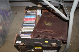 A quantity of cassettes and a briefcase