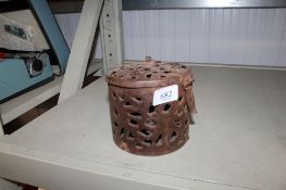 A hinged metal box with pierced decoration (124)