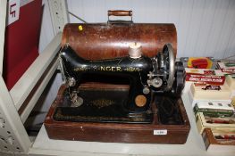 A Singer sewing machine in fitted wooden case