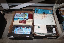 Two boxes containing various duvet covers