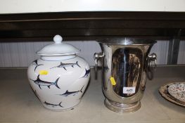 A porcelain jar and cover decorated with various fish together with a twin handled wine cooler