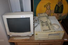 A Unisys Monitor together with a Viglen Professional 4DX475 computer lacking power lead and a