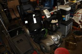 An electric mobility scooter fitted front basket, indicators and charger