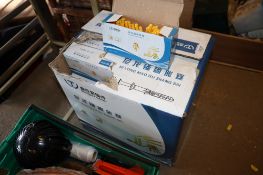 A box containing a quantity of wall plugs and screws