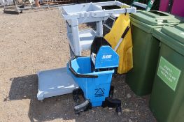 A plastic utility trolley and an SIR mop bucket