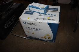 A box containing a quantity of wall plugs and screws