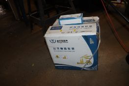 A box containing a quantity of wall plugs and screws
