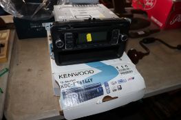 A Volkswagen 2011 car head unit with unassociated box