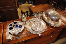 A collection of various silver plated ware to include various cruet items; silver plated food cover;