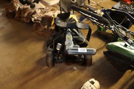 A Powakaddy Freeway electric golf trolley with battery charger and carry case