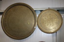 A large Eastern brass engraved tray and a smaller similar