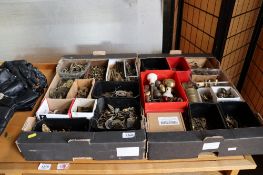 Two trays of various brass fittings; to include door handles, picture hooks, key holes etc.