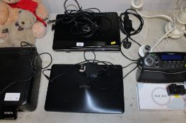Three laptops with charger leads