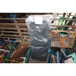 A bag containing seven black baize tablecloths measuring 92" x 76"