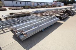 Pallet of varying lengths of Armco crash barrier. Some with fluted ends.