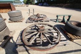 Pair of steel banded wooden wagon wheels.