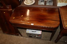 A mahogany fold over tea table, raised on square tapering supports