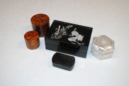A graduated set of three burr wood boxes; a black lacquered and mother or pearl inlaid trinket box