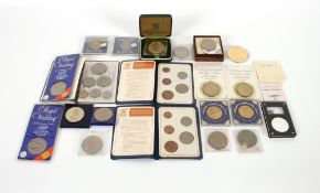 A box containing various commemorative coinage to include crowns, 1951 boxed Festival of Britain