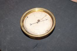 An E.J. Dent of Paris circular brass cased barometer / thermometer